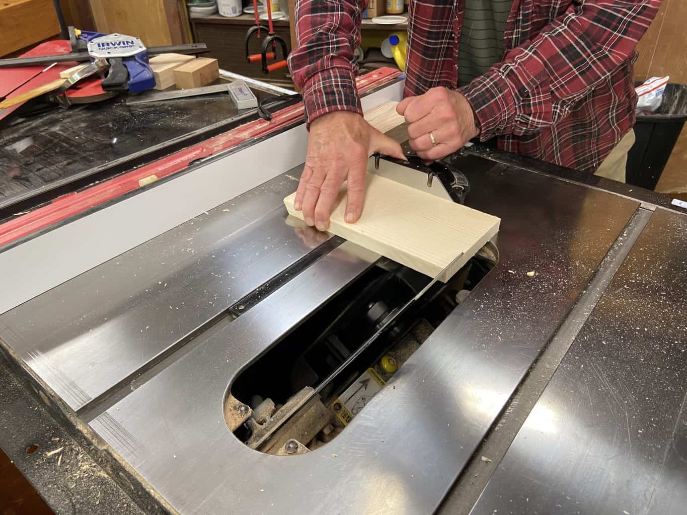Man showing how to make a jointer jig for a table saw