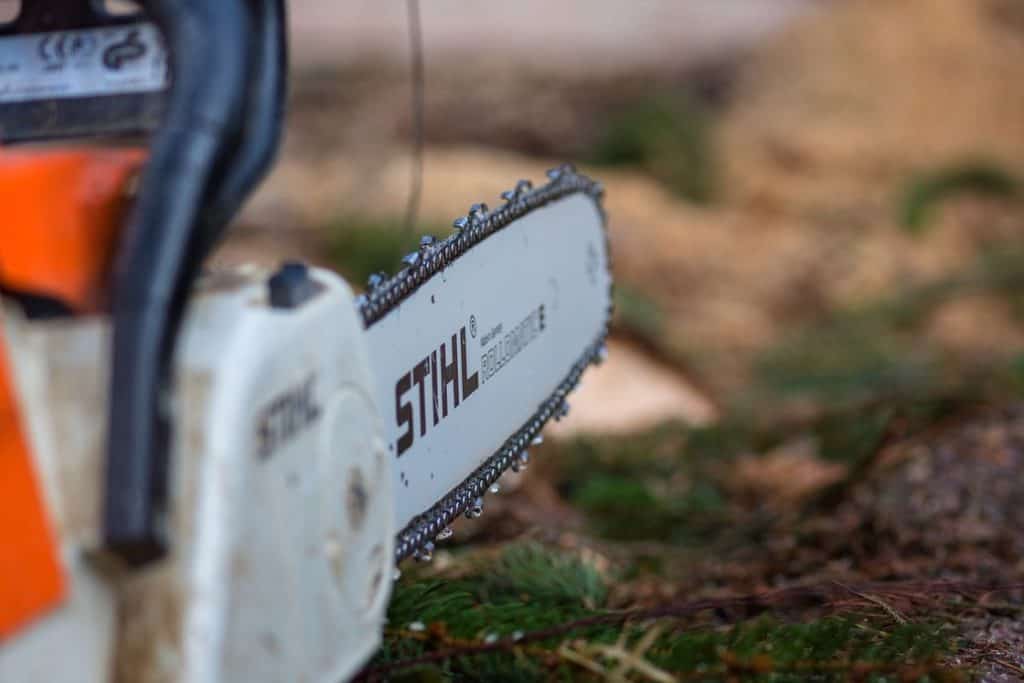 Stihl chainsaw laid on the ground