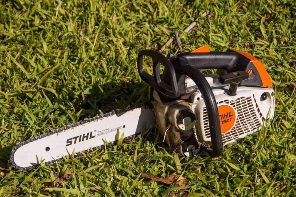 Stihl chainsaw placed on the grass